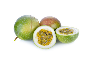 whole and half cut passion fruit on white background