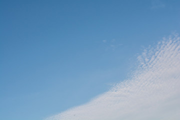 Blue sky with beautiful white clouds in sunny day.
