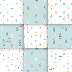 Fototapeta premium Scandinavian pattern with fir trees and triangles. Seamless winter patterns, hand drawn in black ink. Perfect for gift wrapping or printing on fabric.