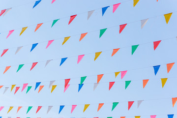 Colorful triangle flags hung across the beautiful blue sky.