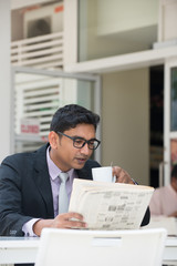 Fototapeta premium indian male drinking at cafe