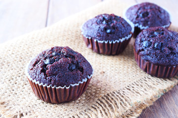 Close up of banana chocolate cupcakes on a sackcloth.
