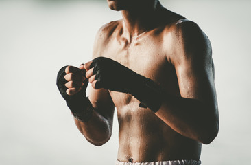 The man Muay Thai on a white background