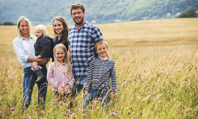 Fototapeta premium Family Generations Parenting Togetherness Field Nature Concept