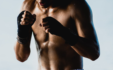 The man Muay Thai on a white background
