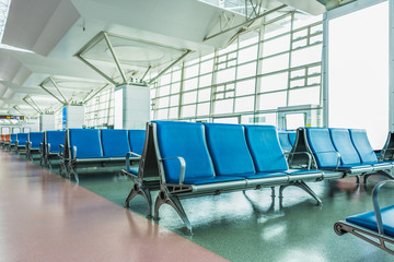 Rows of empty chairs at airport in city of China.