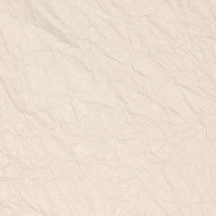 Recycled crumpled light brown paper texture or paper background for design with copy space for text or image.