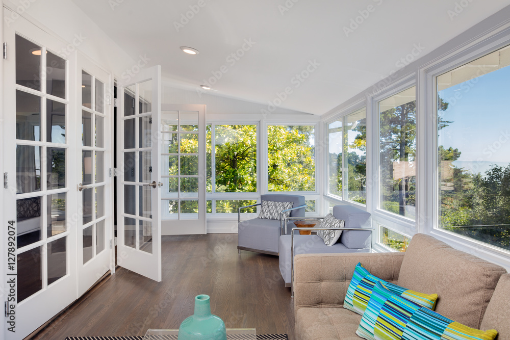 Wall mural Bright solarium-style sunroom off the master suite.