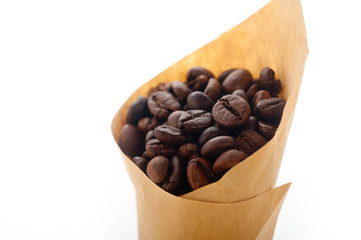 espresso coffee beans on a paper cone
