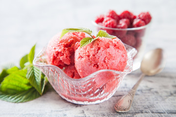 raspberry ice cream with berries, selective focus
