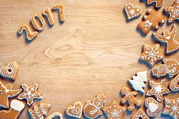 Merry Christmas and Happy new year! Traditional Christmas cookies on wooden table. Top view. Christmas baking concept