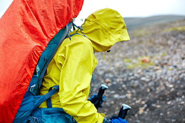 woman hiker on the trail in the Islandic mountains. Trek in National Park Landmannalaugar, Iceland....