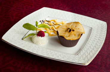 Chocolate cupcake with candied fruit and nuts