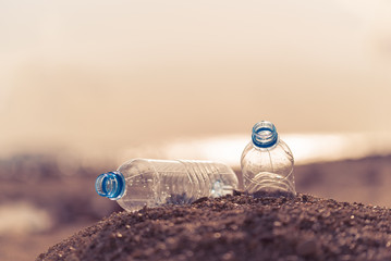 Empty plastic waste bottles in a plastic shopping bag