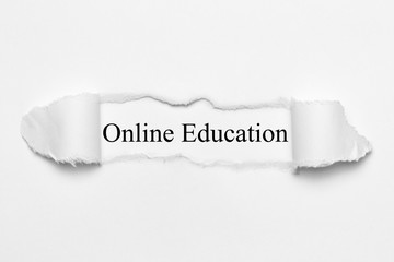 Online Education on white torn paper