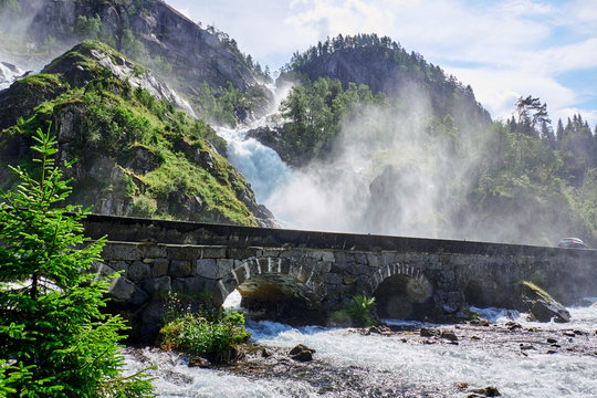 Laatefossen in Norway running under a graite bridge and in to a river