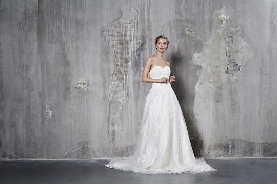 Glamorous bride in white wedding dress, studio
