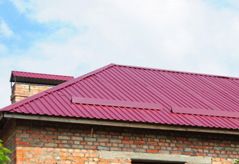 Roofing Construction. Metal Roof Installation.