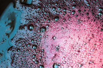 Gordijnen Bubbles the wort red wine during fermentation © fotolesnik
