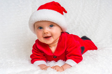 Funny Christmas baby in Santa Claus costume
