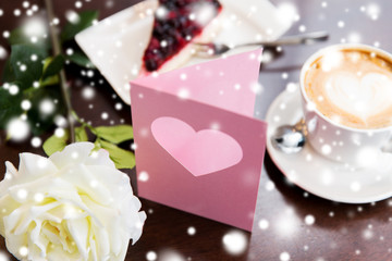 close up of greeting card with heart and coffee