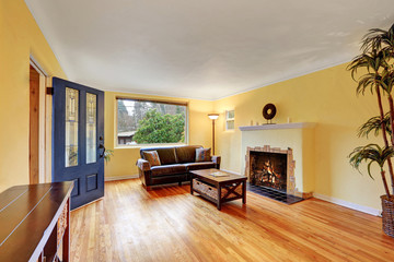 Cozy living room interior with warm yellow walls