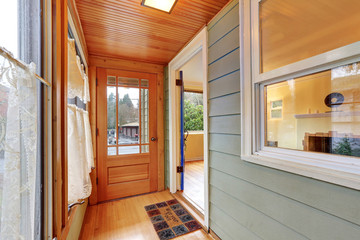 Entrance porch interior with wood paneling
