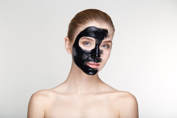 Beauty portrait woman skin care health black mask white background close up