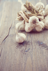 Close up of organic garlic on rustic wooden table