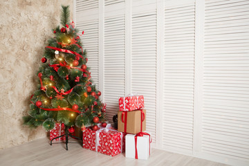 Interior living room with a Christmas tree and decorations.

