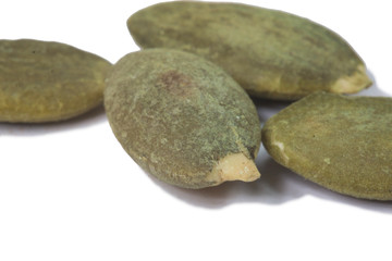 Dried pumpkin seeds isolate on white
