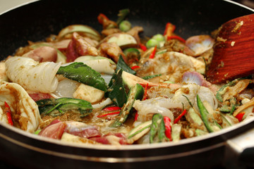 Cooking ,Fried jasmine rice in green curry with mixed meat.