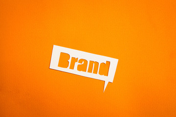 The word Brand in speech bubble