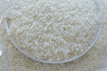 Thai jasmine rice paddy on cup in plastic bag