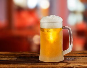 cold light beer glass mug in a pub