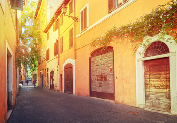 old town italian street in Trastevere with sunshine, Rome, Italy
