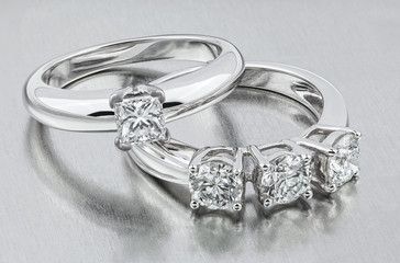 Diamond ring. Two diamond rings. Golden wedding rings. Bride rings with diamonds.