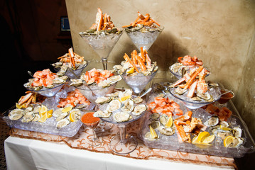 Mussels and other marine products served in large cocktail dishe