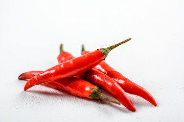 Red Chili Peppers On White