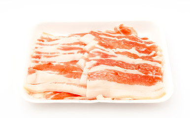 Slide of  raw pork  on white background .