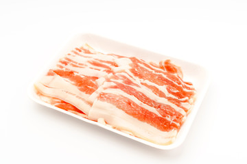 Slide of  raw pork  on white background .