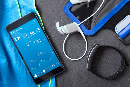Smartphone with an unknown application for runners on the stone slab. Application was created with graphic program