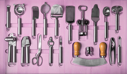 a set of kitchen utensils in a wooden box