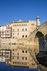 Fototapeta premium River reflection of historical houses in Valderrobres