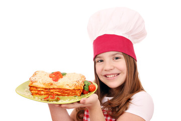 happy little girl cook with tasty lasagne