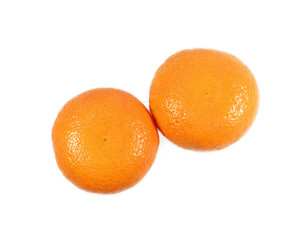 Close-up of two ripe bright color oranges isolated on white background 