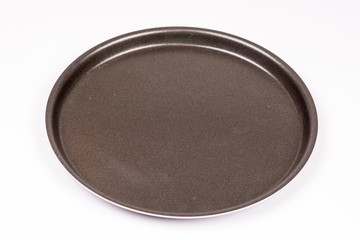 Empty new teflon pan over white background