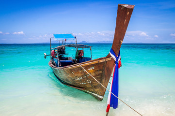 Longtail boat on beach in Thailand
