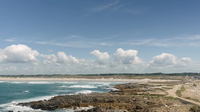 The beach and coastline at Pointe de la Torche in Brittany, France on a summer day.