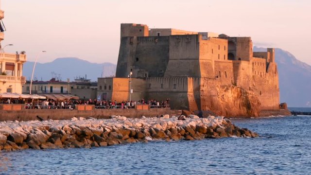 Naples panoramic view of Castel dell Ovo at sunset in the bay of Naples italy
